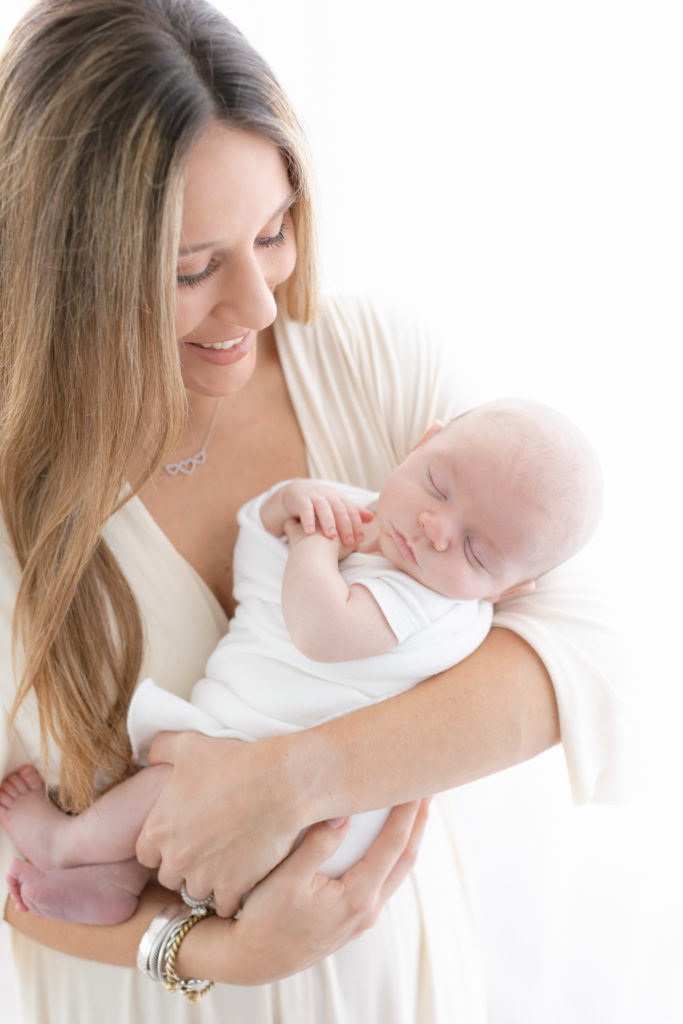 photograph of newborn in moms arms