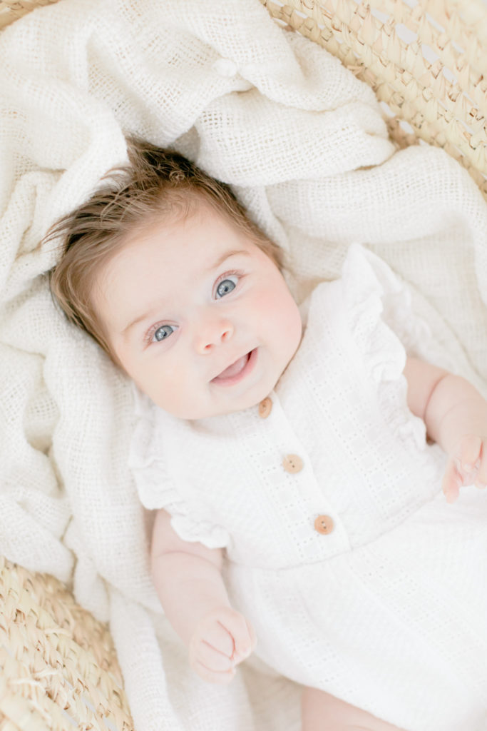 portrait of baby girl looking up at camera