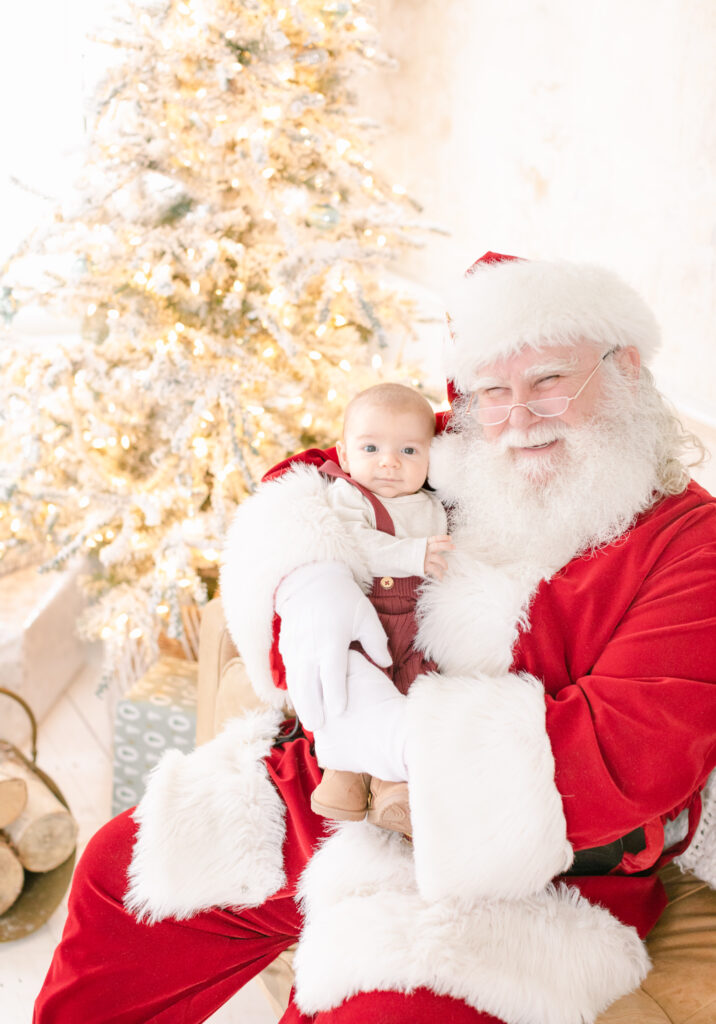 santa claus and baby pose for mini session