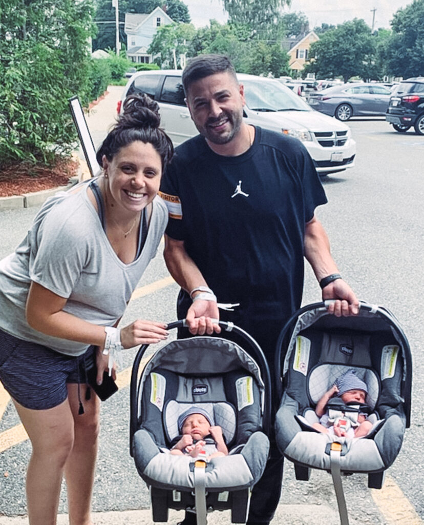 new twin parents taking their babies home from the hospital