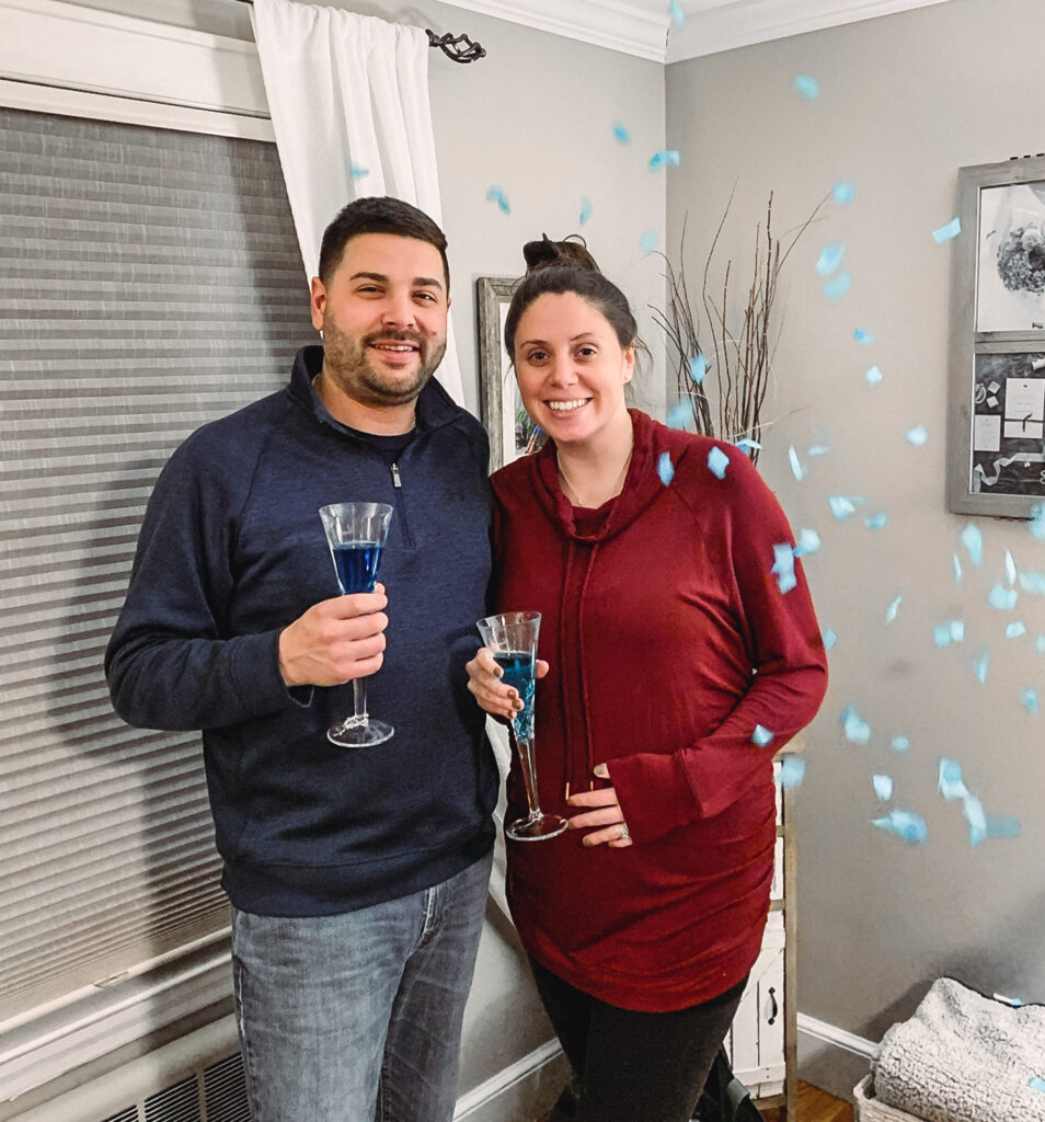 couple smiling during gender reveal