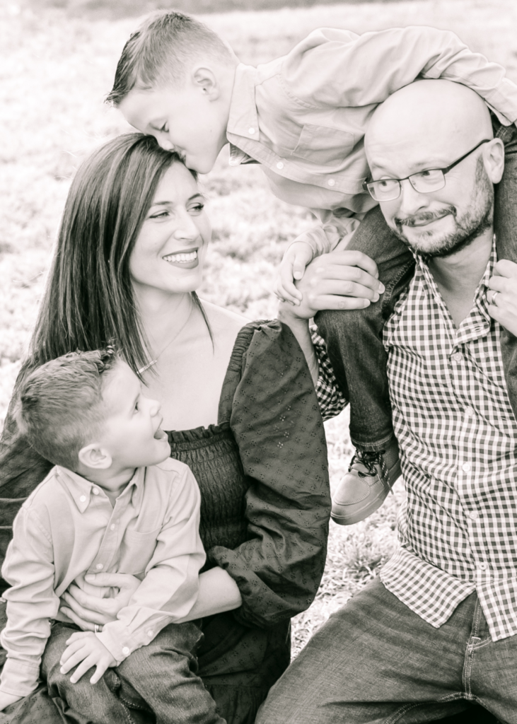 black and white image of family of 4 during massachusetts family photo session  