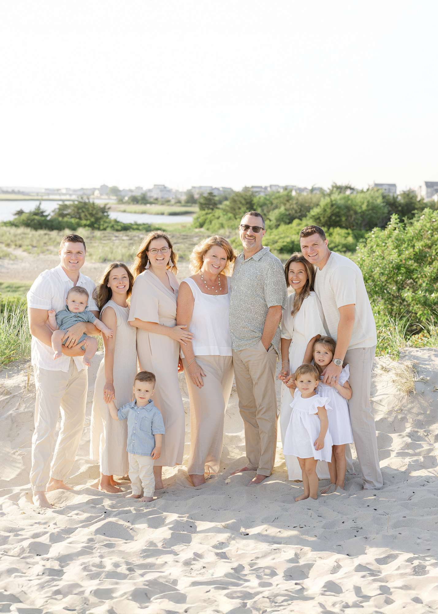 Multi-generational family portrait on the sand dunes at Rexhame Beach in Marshfield, MA during a summer photo session