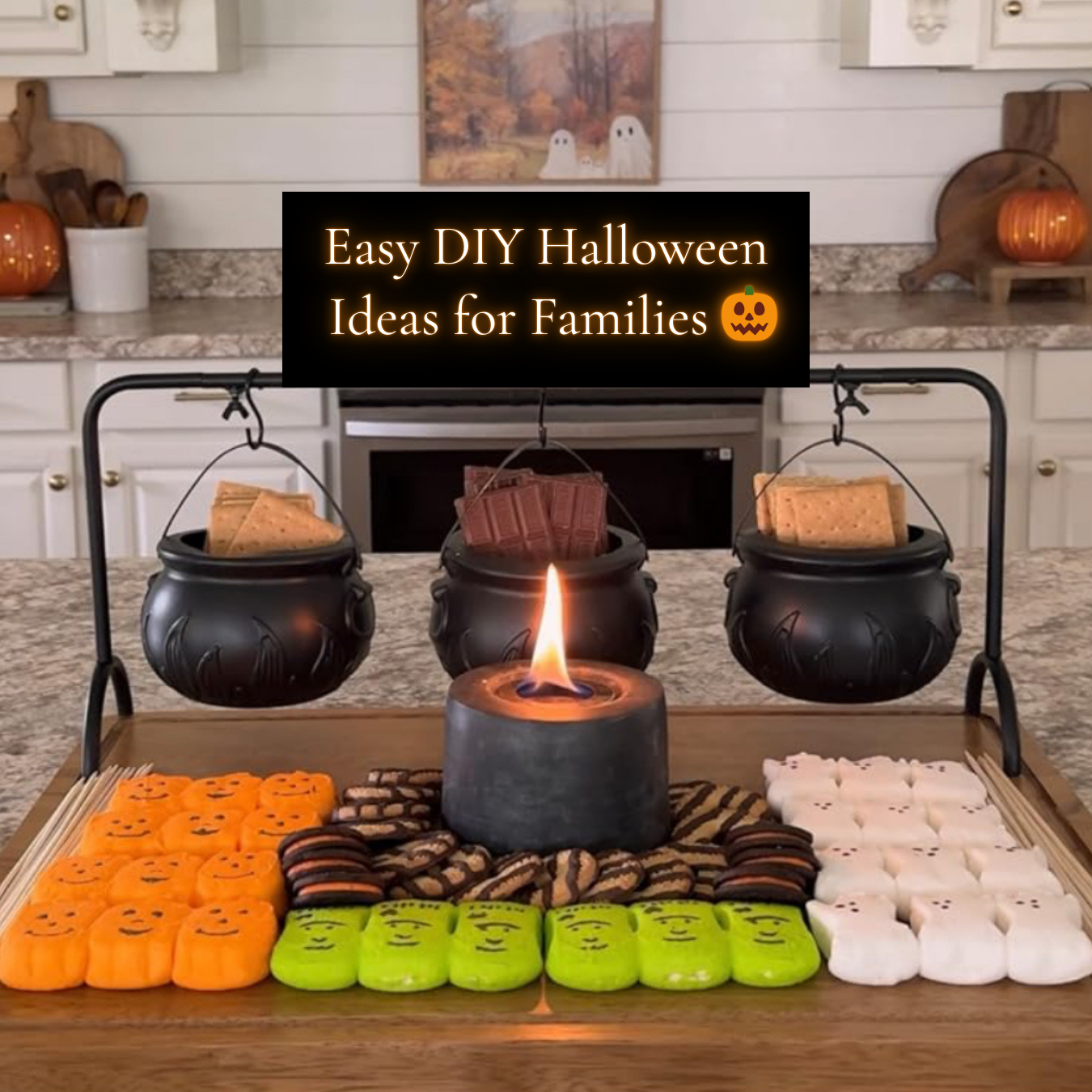 Easy DIY Halloween ideas for families featuring a festive s’mores bar with mini cauldrons of chocolate and graham crackers, colorful marshmallows, and a tabletop fire pit.